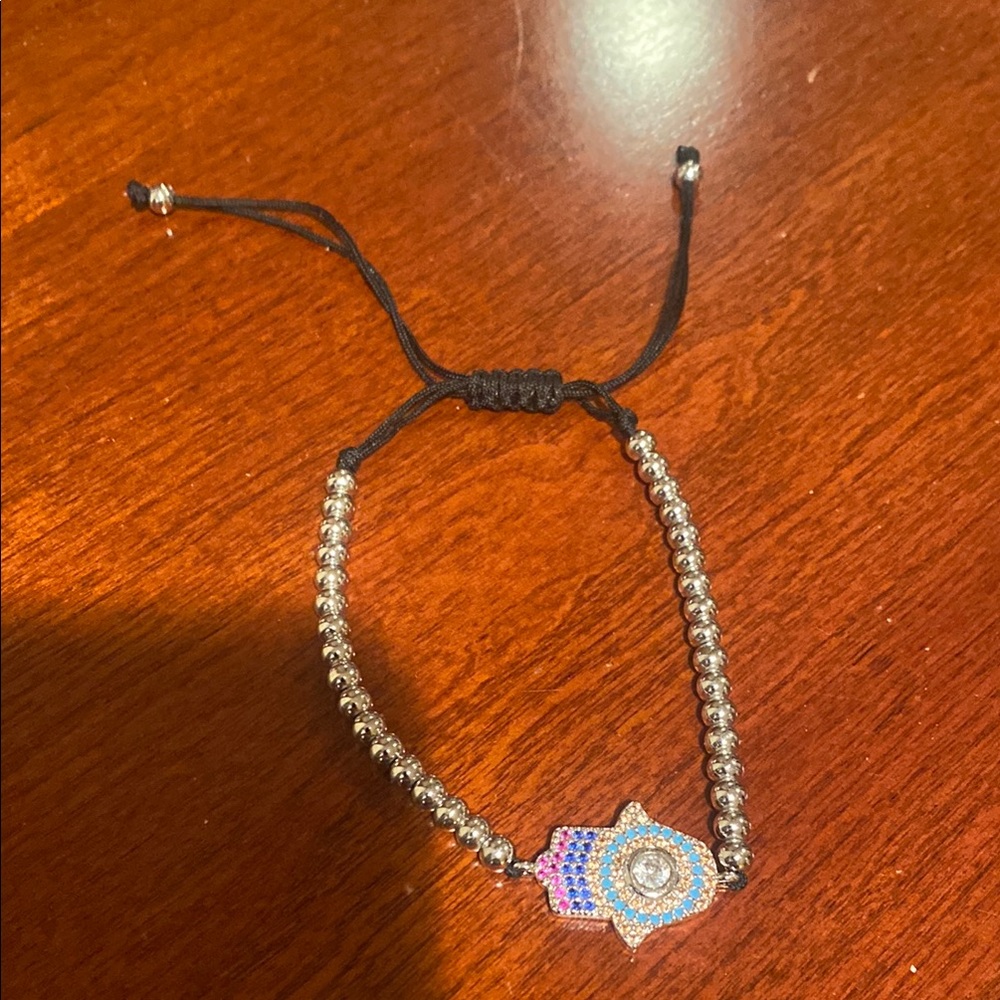 Beautiful silver bracelet with adjustable string closure